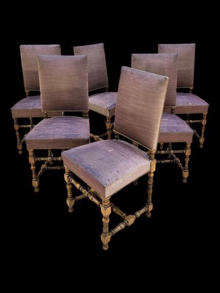 A set of six carved, molded, and patinated wooden 