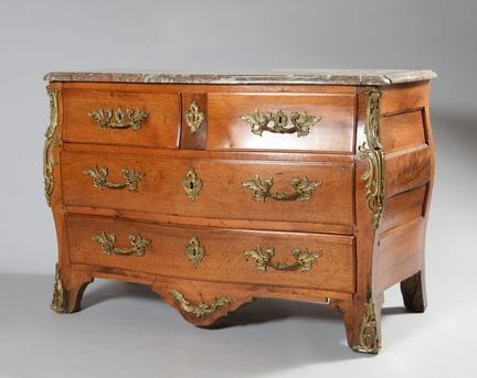 Curved walnut chest of drawers with four drawers a