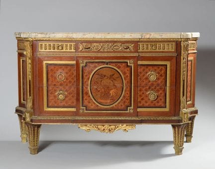 A large chest of drawers with curved sides, made o
