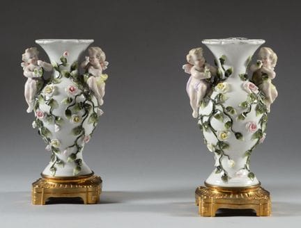 Pair of polychrome porcelain vases decorated with 