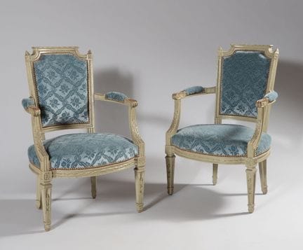 A pair of carved, gray-lacquered cabriolet armchai