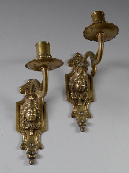 Pair of small bronze wall sconces with a single ar