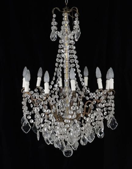 Large cage-style chandelier with a brass frame, pe