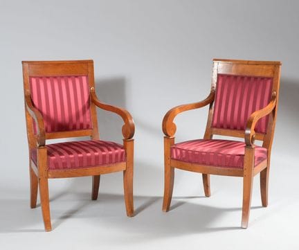 Pair of cherry wood armchairs with curved armrests