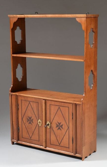 A wall-mounted shelf made of cherry wood with Malt