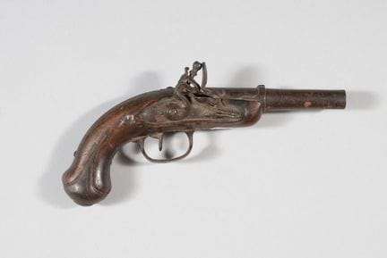 Flintlock pistol with walnut stock, iron fittings,