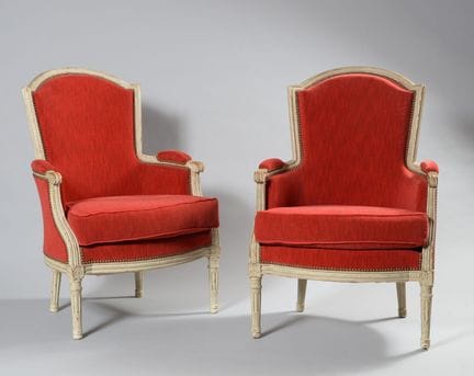 A pair of cabriolet-style armchairs made of gray-l