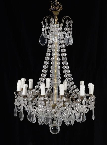 Cage-style chandelier with a brass frame, pendants
