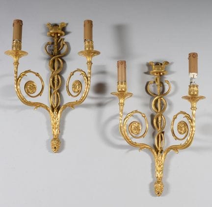Pair of gilded bronze wall sconces in the form of 