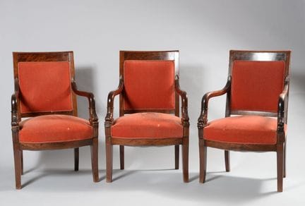 A set of three armchairs in mahogany and mahogany 