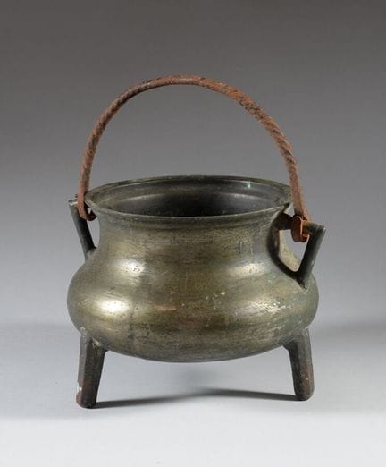 Bronze tripod cauldron with a removable handle mad