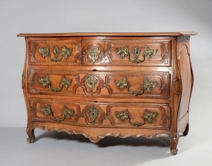 Curved, molded walnut chest of drawers with five d