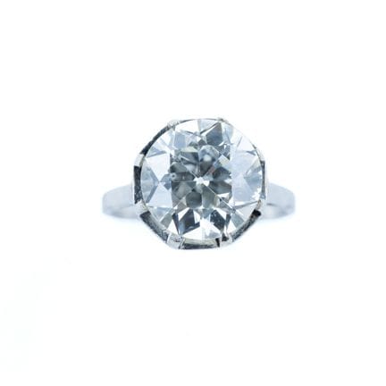 An 850-th platinum solitaire ring set with an old-