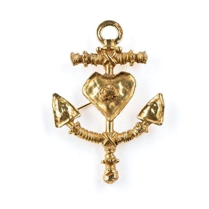 CHRISTIAN LACROIX. 
Gold-plated metal brooch depic