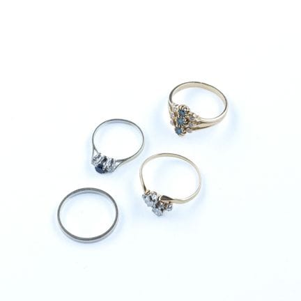 A set of four rings in 18k yellow and white gold (