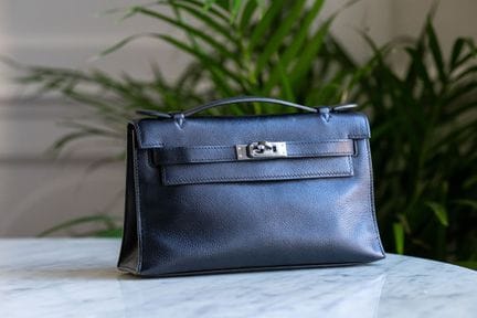 HERMES. 
"Kelly" clutch in black swift calfskin, w