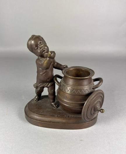 CLOSED.  Child drinking. Bronze with a brown patin