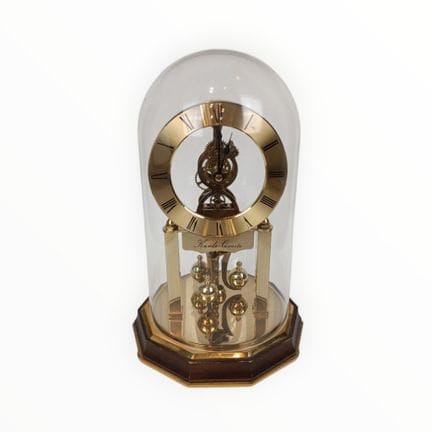 CLOCK  A torsion clock with a bell-shaped top. Kun