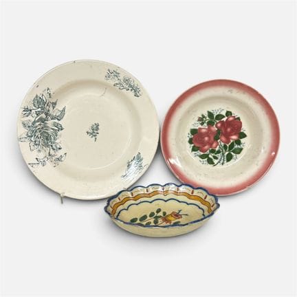 TWO PLATES AND A GLASSED BOWL, made of ceramic; on