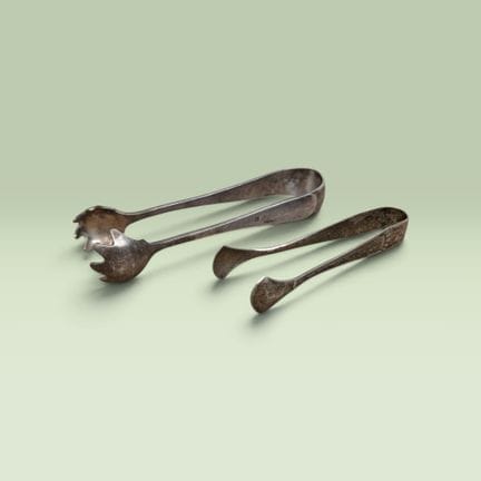 TWO metal SUGAR TONGS, one made of German WMF meta