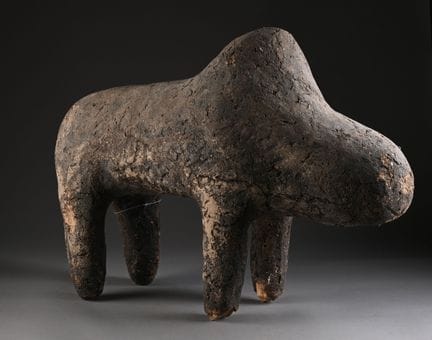 BAMBARA, MALI. 
Large earthen Boli on wooden frame
