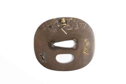 GIAPPONE
Tsuba raffigurante un anziano con un ombr