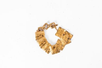 YVES SAINT LAURENT
Bracciale in metallo dorato con