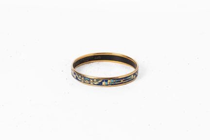 HERMES
Bracciale a giro in metallo dorato smaltato