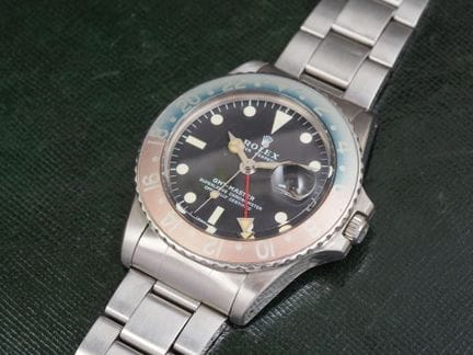 劳力士GMT型号1675，约1972年
钢制腕表。圆形表壳，配有刻度外圈，表圈内圈为“百事可乐”配色
