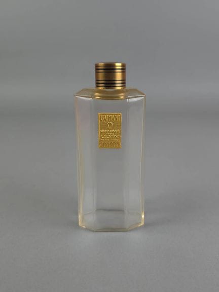 COTY – L'Aimant
Glass perfume bottle with a metal 