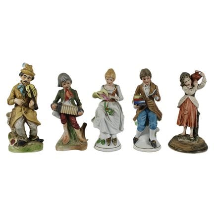 NOVE SCULTURE  in porcellana raffiguranti personag