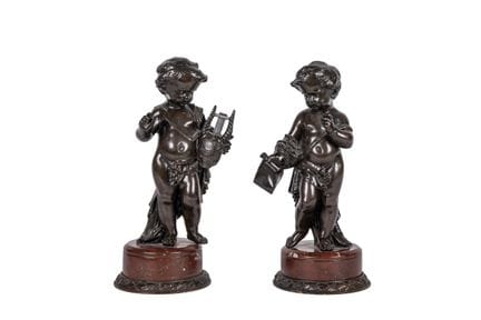 Pair of putti in patinated bronze on a red marble 