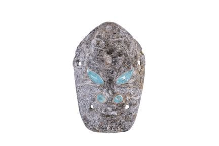 Mask made of carved and polished stone. Ancient Ch