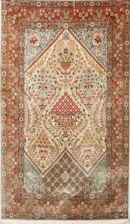 Persian silk rug. Floral and vase decoration in sh