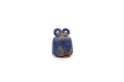 Eye idol made of carved and polished lapis lazuli.