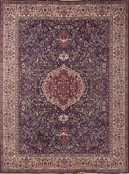 Large oriental rug made of wool. Profuse floral an