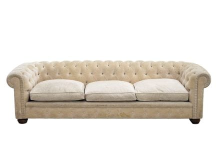 Large Chesterfield sofa upholstered in ecru. 20th 
