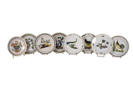 Eight plates in glazed and enameled French ceramic