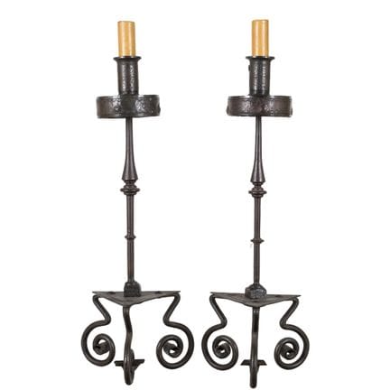 Pair of French wrought iron candlesticks or torch 