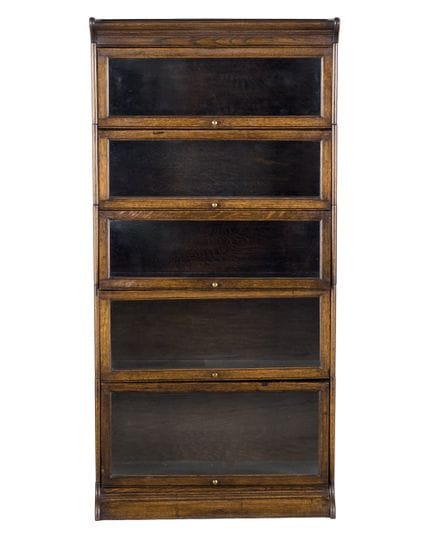 Globe bookcase in carved oak. Early 20th century. 