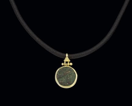 18K yellow gold pendant with an inlaid Greek coin.