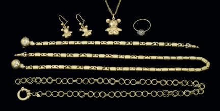 Assorted 14K gold jewelry pieces: chains, necklace