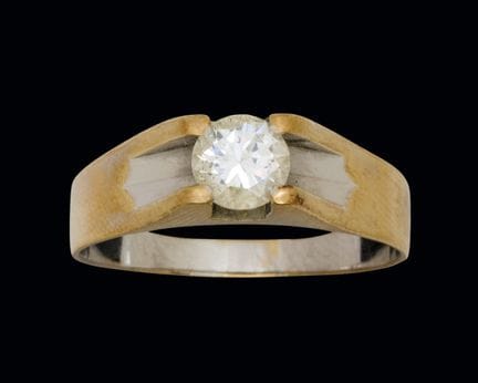 18K two-tone gold ring with a diamond weighing app