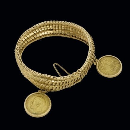18K yellow gold bracelet with two English pound pe
