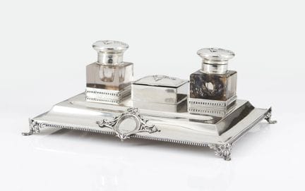 A Portuguese silver inkstand
Comprising two glass 