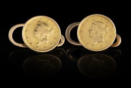 A pair of gold and coin cufflinks
Gold and two Ame