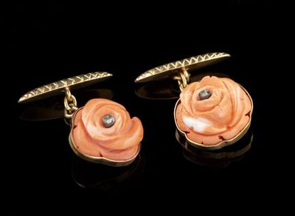 A pair of coral and gold cufflinks
Gold
Set with c