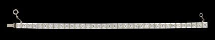 Una pulsera «rivière» de diamantes
Oro blanco, ley