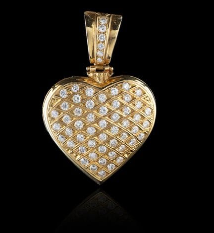 Colgante de corazón de oro y diamantes
Oro, ley 0,