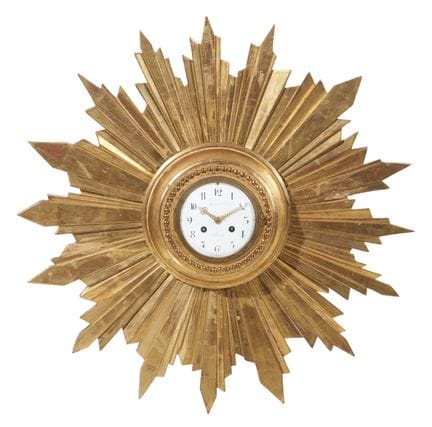 Horloge murale en bois sculpté et doré
Bois sculpt